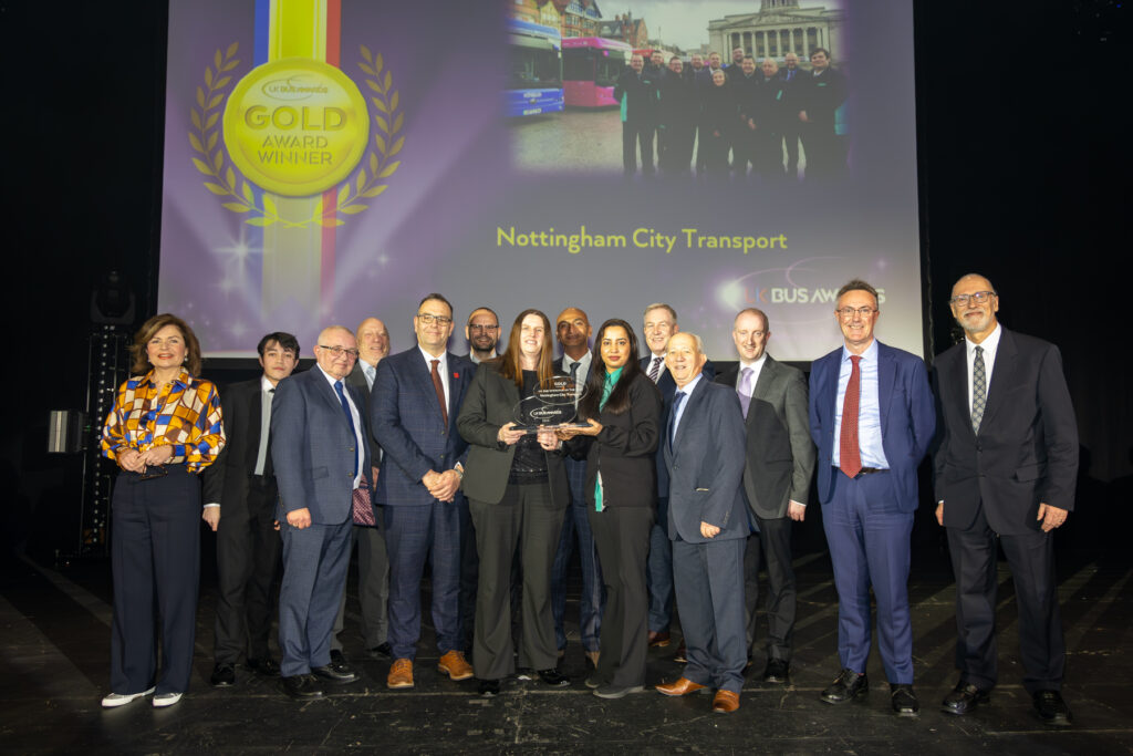 Nottingham city transport team accepting award on stage